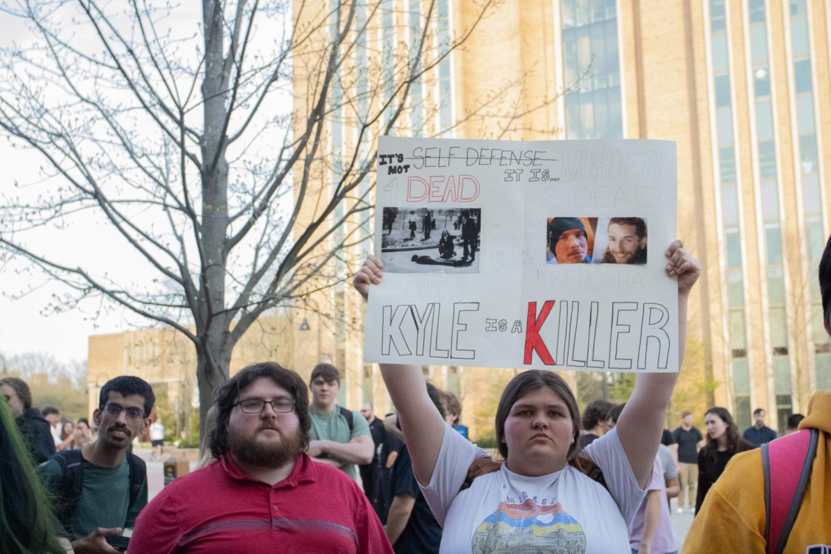 Two people protest Kyle Rittenhouses visit to Kent States campus April 16, 2024.