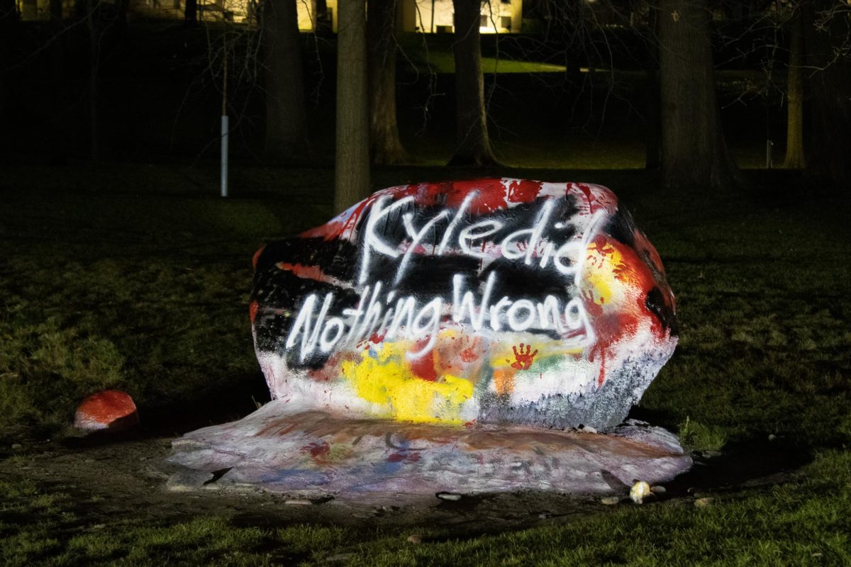 The message Kyle did Nothing Wrong is left behind on the Rock after the student led protests earlier in the day April 15, 2024, against Kyle Rittenhouses presence on campus.