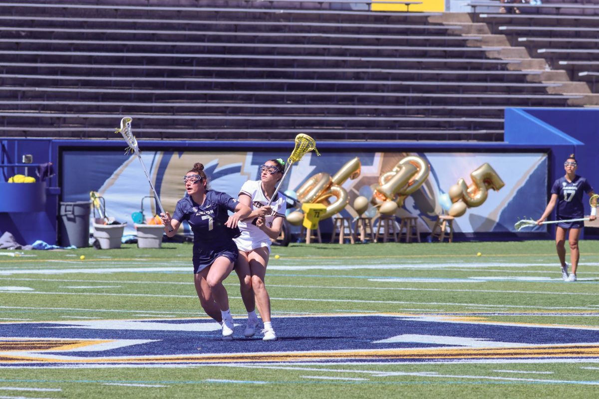 Junior Sidney Dering on defense against the University of Akron during their game on April 7, 2024.