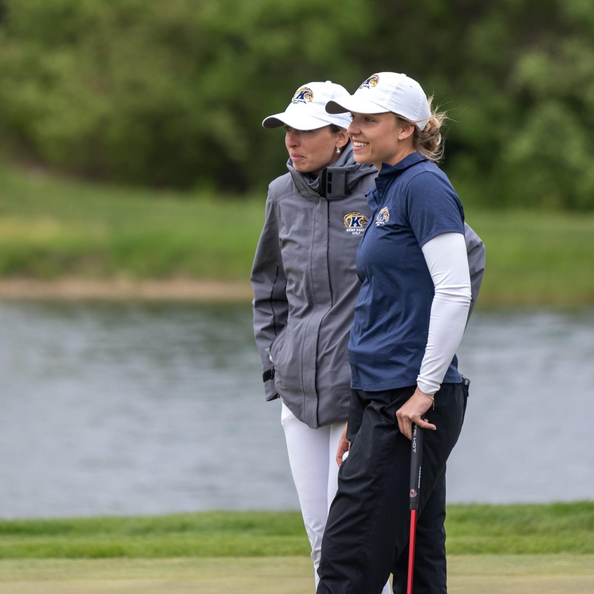 Senior Hester Sicking and Assistant Coach Manuela Carbajo Ré share a moment while waiting for Sickings putt during the final round of the Mid-American Conference Championships in Grove City, OH, on April 24, 2024.