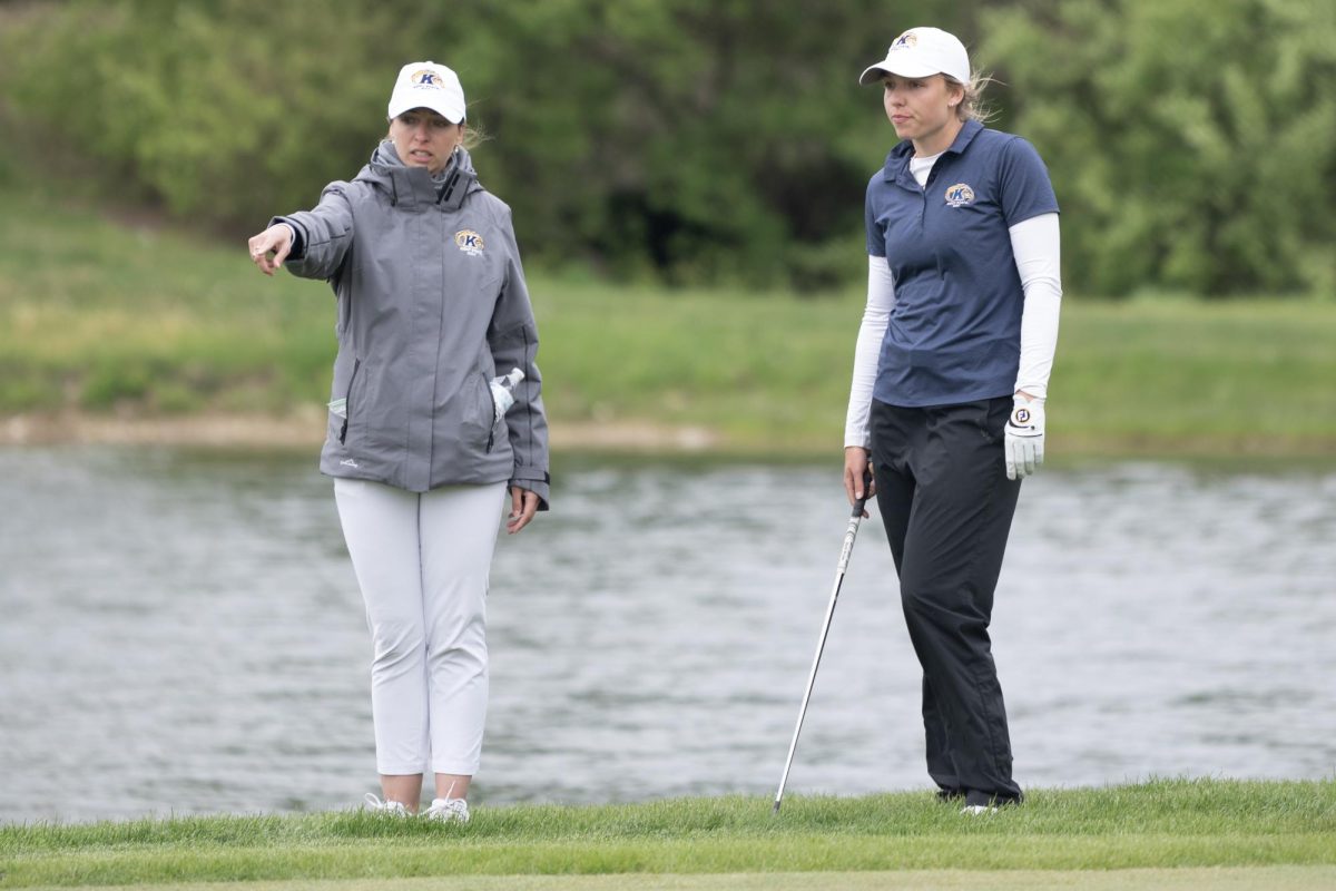 Assistant Coach Manuela Carbajo Ré, left, and senior Hester Sicking survey the putt on the 13th hole at the final round of the Mid-American Conference Championships in Grove City, OH, on April 24, 2024.