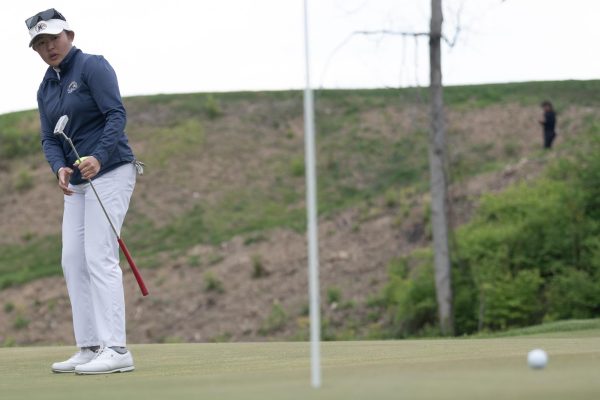 Sophomore Leon Takagi watches the putt on the eighth hole of the final round of the Mid-American Conference Championships in Grove City, OH, on April 24, 2024.
