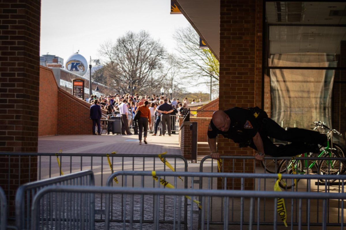 An officer has to jump over a barricade that was put up due to the Rittenhouse event April 16, 2024.