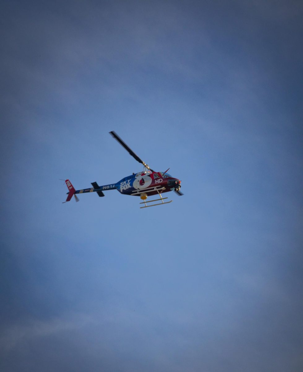 A helicopter from WJW-Cleveland FOX 8 News flies above Kent State campus on April 16, 2024.