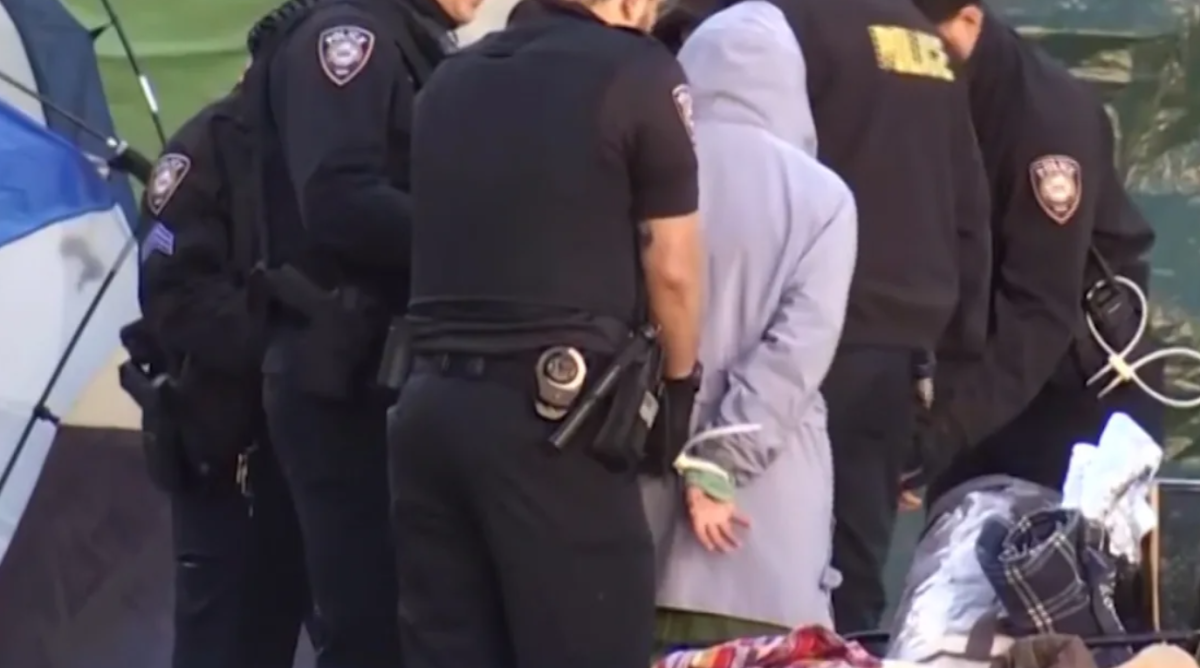 A+protester+is+arrested+at+Yale+University+on+Monday.+Police+said+those+arrested+face+misdemeanor+charges+of+criminal+trespassing.+