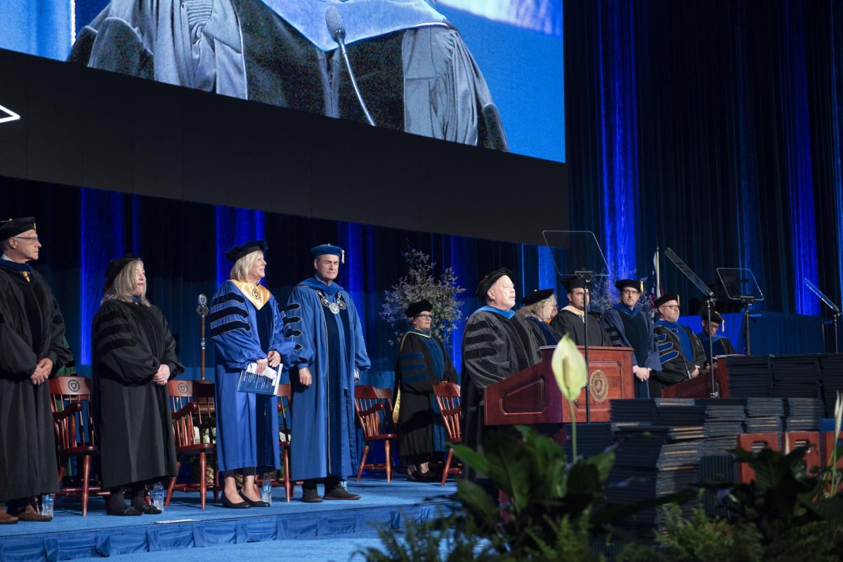 University administration gather on stage before the masters, educational specialist and doctoral commencement on May 9, 2024, at the Memorial Athletic and Convocation Center.