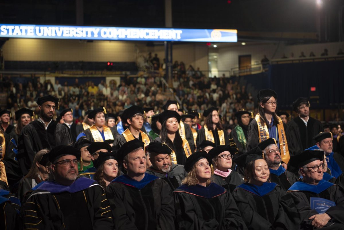 Exchange students stand to be recognized on May 9, 2024, at the masters, educational specialist and doctoral commencement in the Memorial Athletic and Convocation Center.