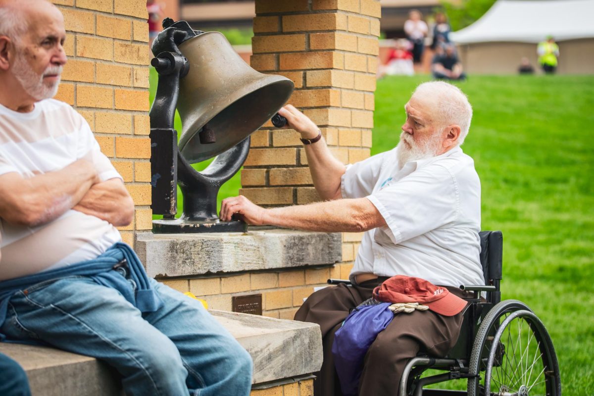 May 4th survivor Dean Kahler rings the bell during the commemoration on May 4, 2024.