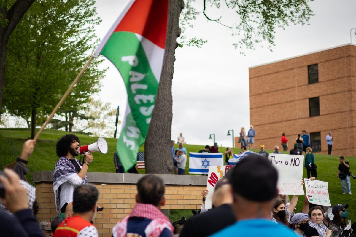 Yaseen Shaikh of SJP speaks to a crowd during a protest on May 4, 2024.