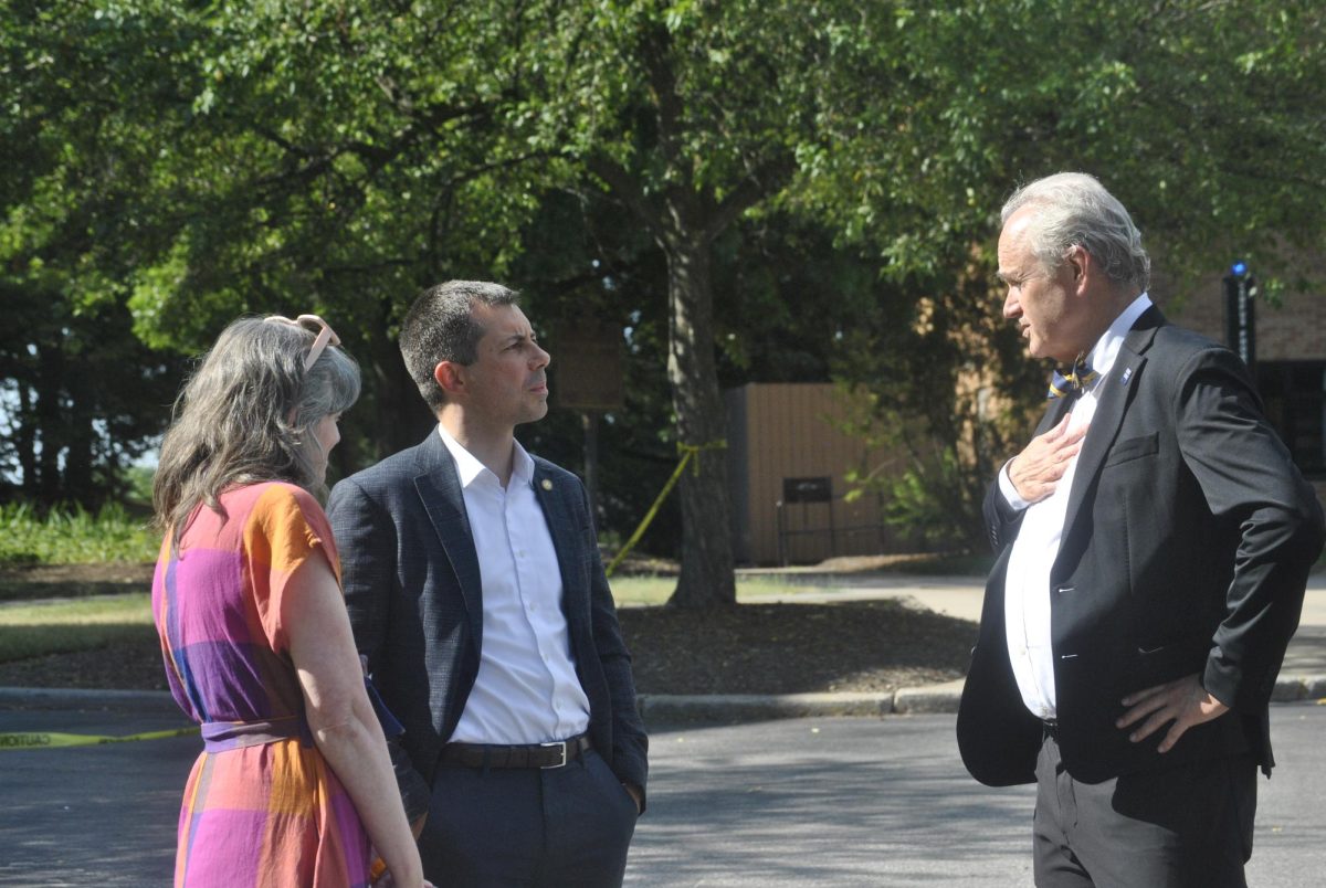 U.S Transportation Secretary Pete Buttigieg meets Kent State President Todd Diacon and Alison Caplan, director of the May 4 Visitor Center, while visiting the site on Monday, June 24.