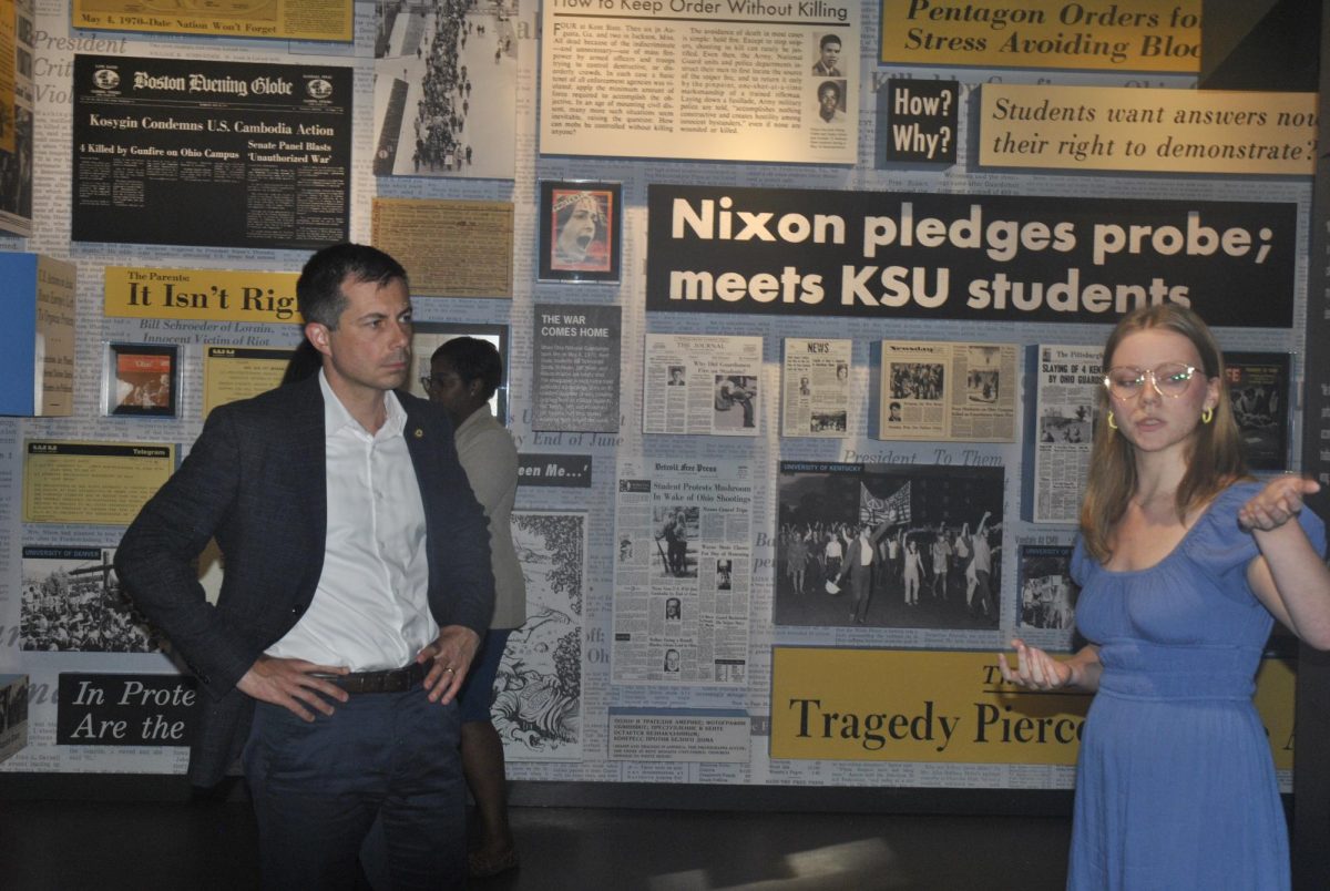 U.S. Transportation Secretary Pete Buttigieg listens as a student employees guides him through the May 4 Visitors Center on Monday, June 24.