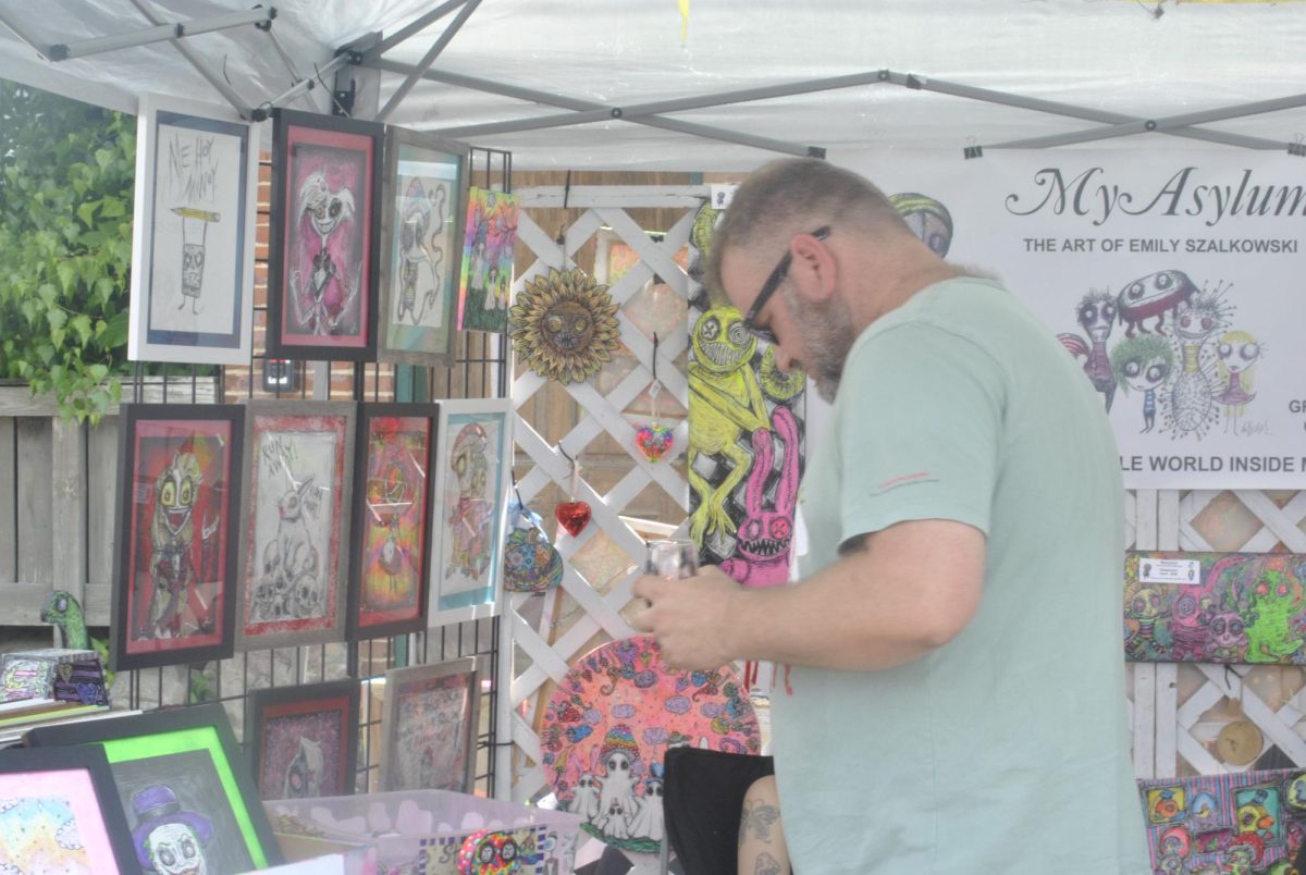 the Art and Wine Festival has been going on for 16 years. This is Arts first time at the festival as his wife has a booth, Diannas Artwork. 