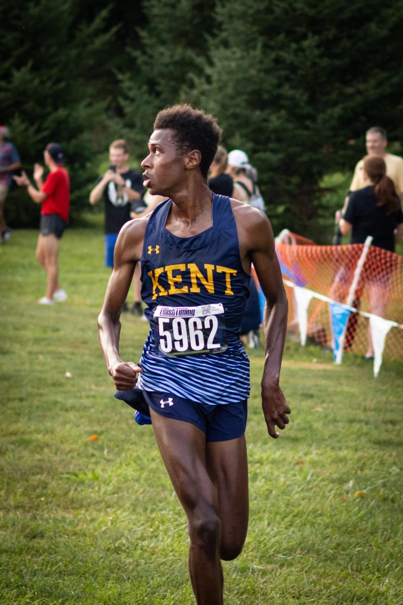 Baidy Ba casts a glance behind him right before he's about to finnish first in the cross country meet on August 30, 2024.