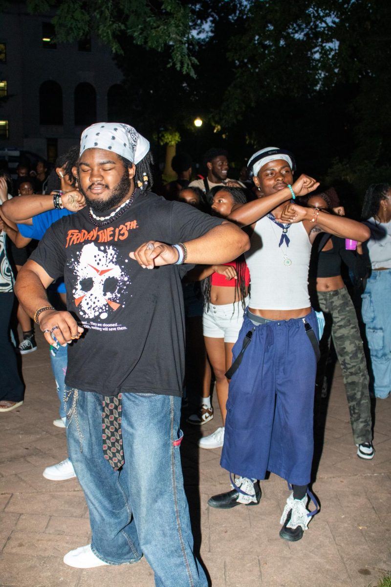 Students line dance together at BUS's Block Party in celebration of the new fall semester outside of Oscar Ritchie Hall at Kent State University on August 29th, 2024. 
