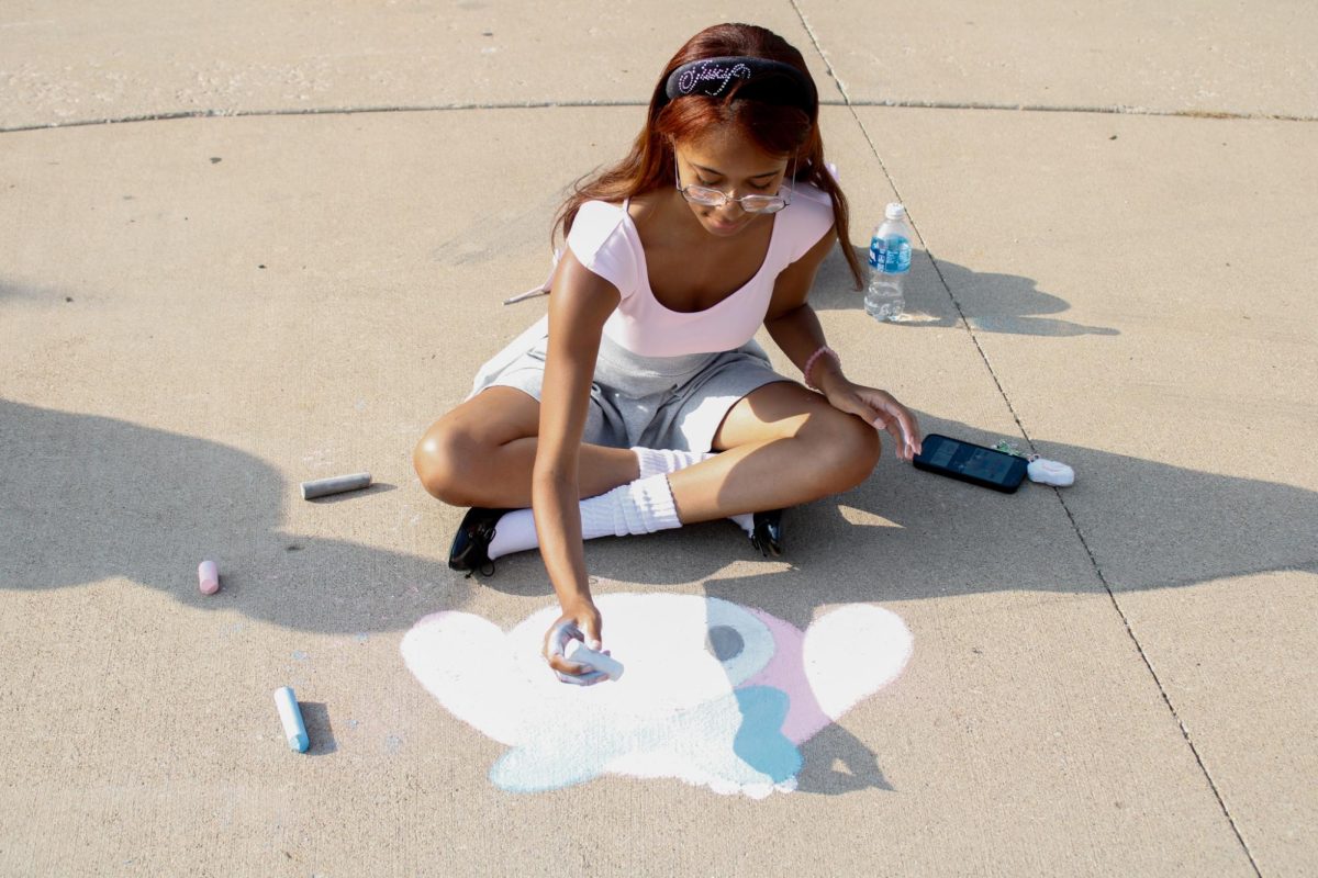 Sophomore Marissa Stewart draws My Melody during the Chalk Competition on Aug. 26, 2024.