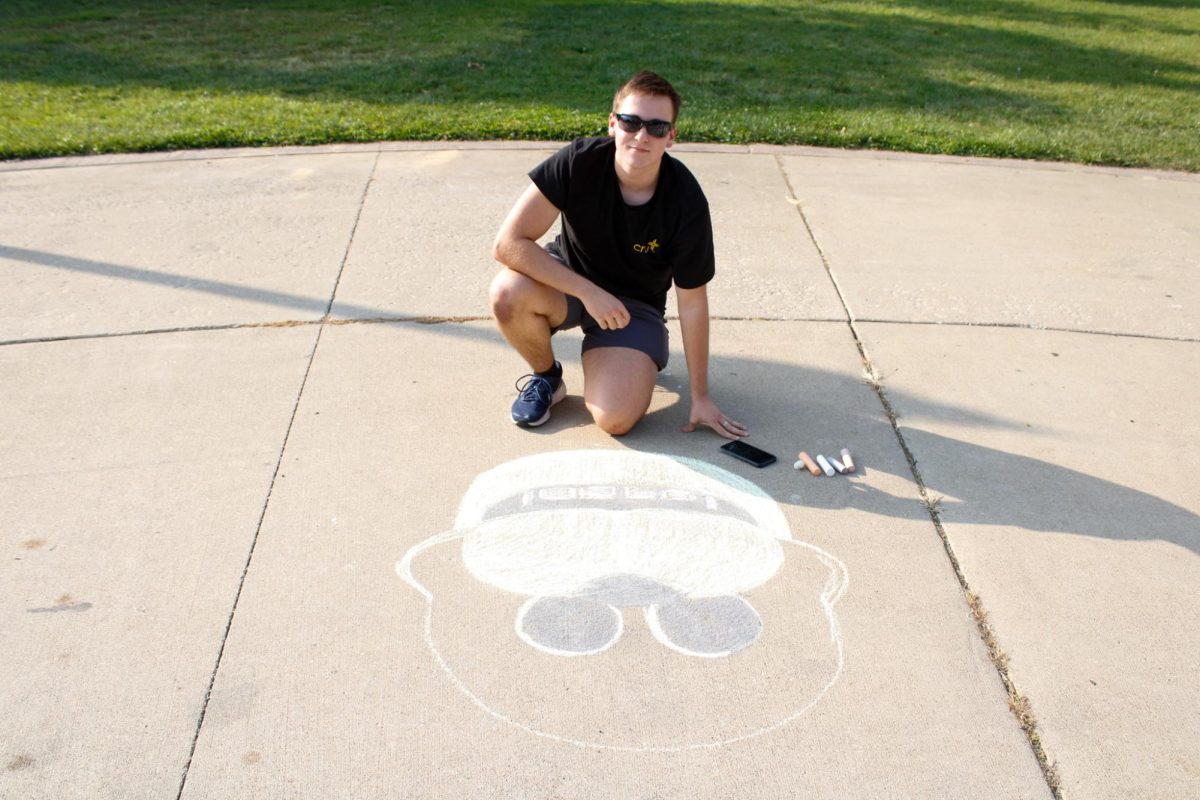 Sophomore Vladyslav Dumych draws the golden version of Freddy Fazbear from Five Nights at Freddy’s during the Chalk Competition on Aug. 26, 2024.