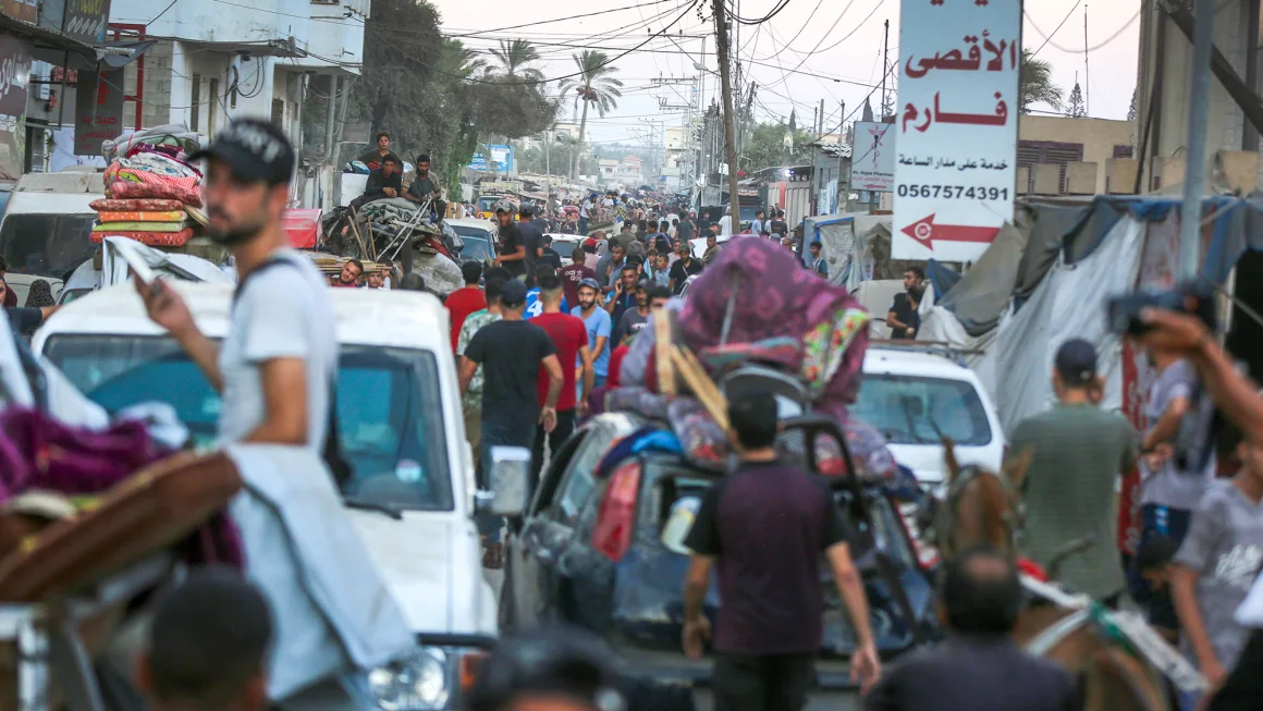 Palestinians move patients from Al Aqsa Martyrs Hospital after the Israeli military issued evacuation orders in an area east of Deir al-Balah, Gaza.