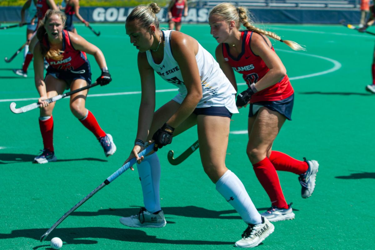 Delfina Larripa, Kent State Freshman and Forward for the Field Hockey Team, is holding the ball from the opposing team, the Liberty Flames, during the fourth quarter, Sept. 1, 2024.