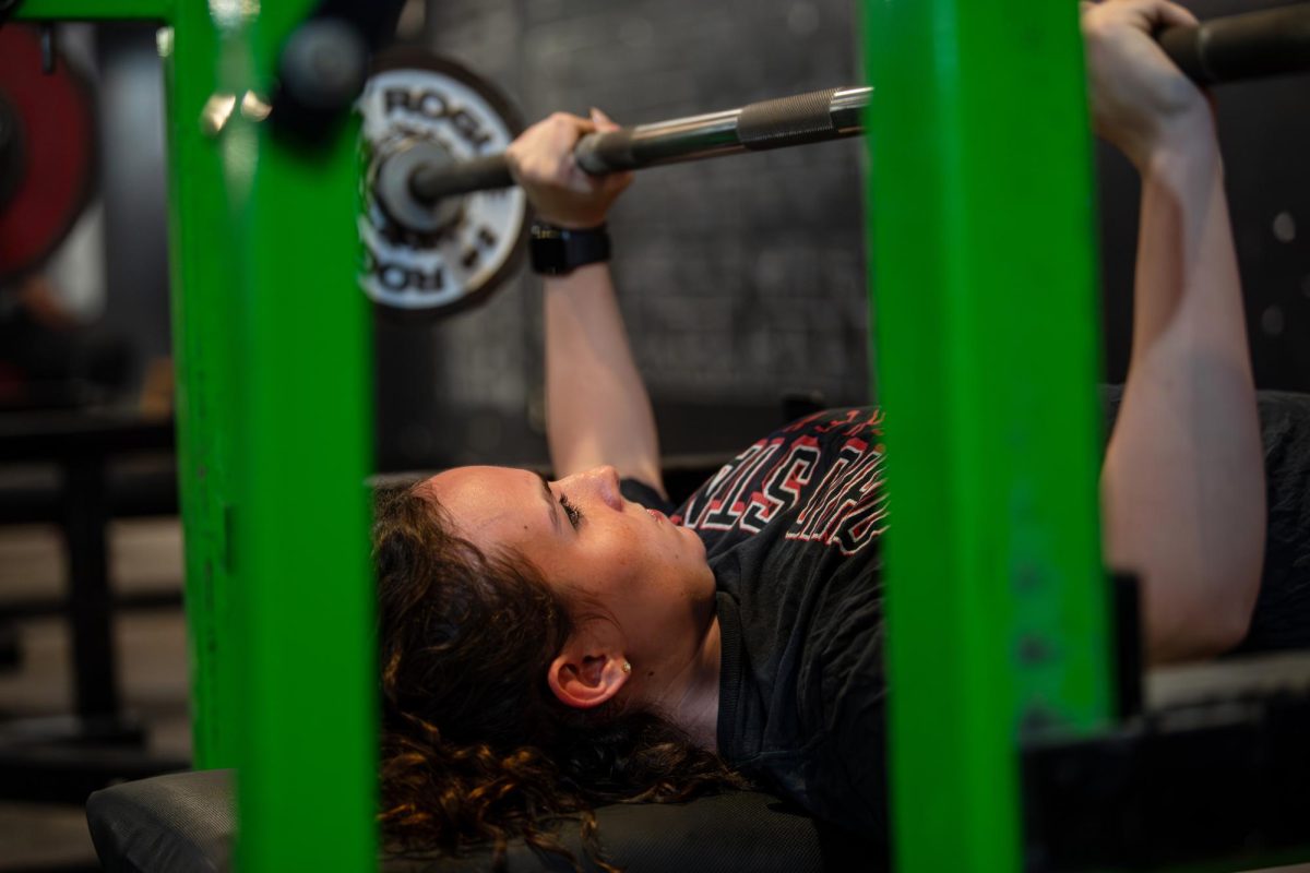 Kent senior biochemistry major Maria Sargent perfroms sets of bench presses at Kent Barbell Club, Wednesday, Sept. 25, 2024.