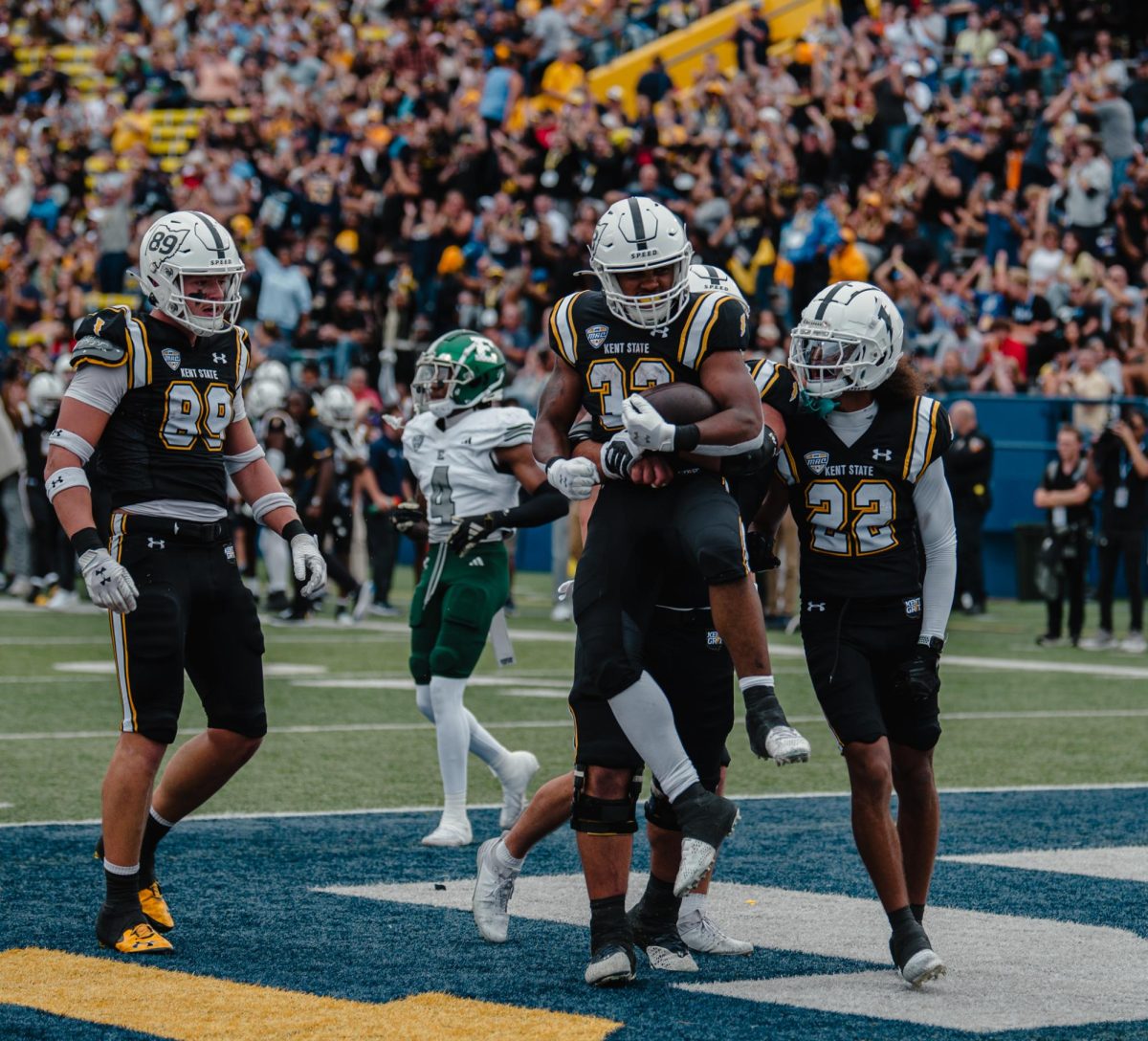 Kent State freshman running back Ayden Harris rushes the middle and scores a touchdown for Kent State in the 1st quarter during the game against Eastern Michigan, Saturday, Sept. 28, 2024.