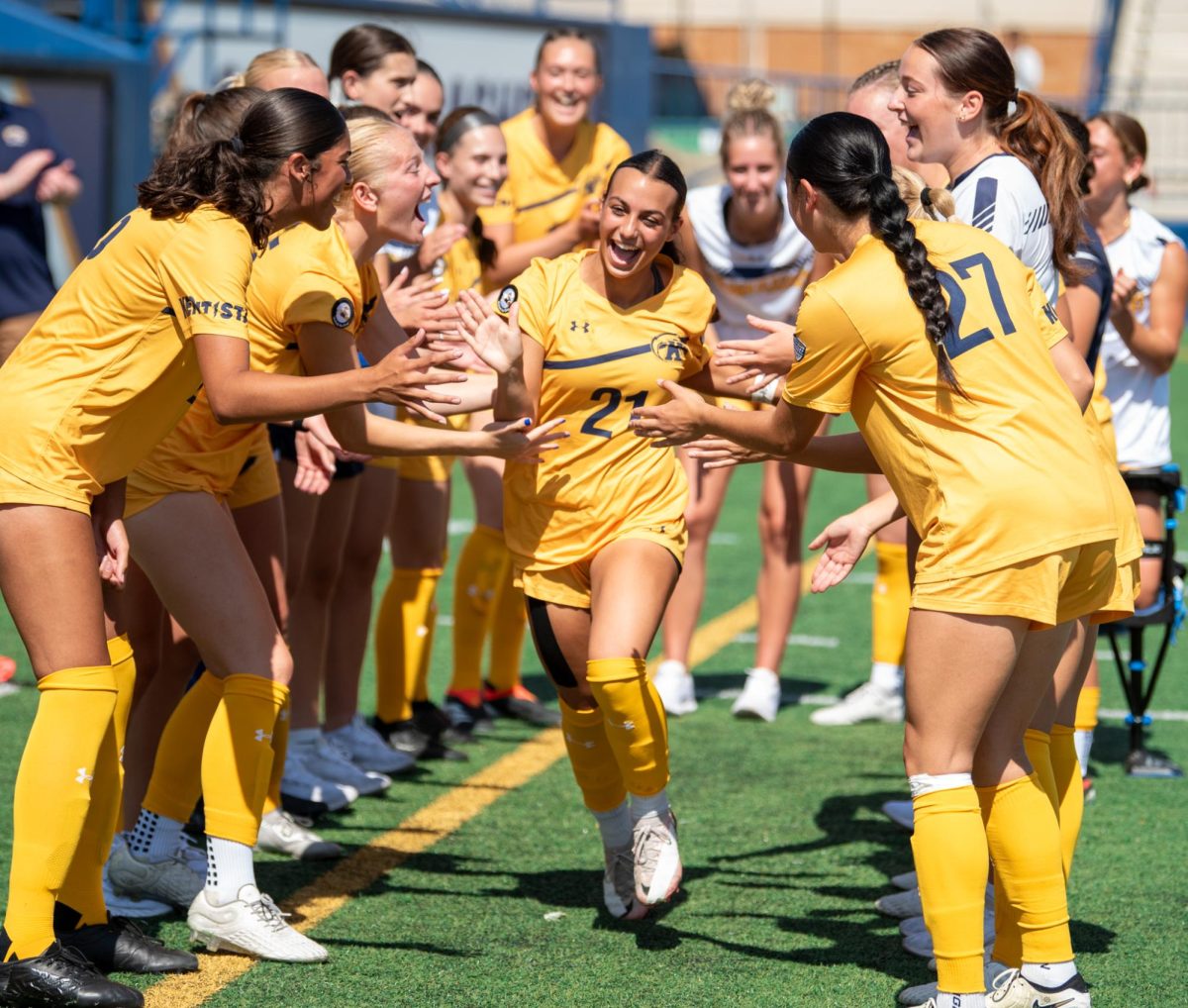 Alanna Raimondo, Kent State sophomore midfielder, is cheered on by her team as they introduce the starting lineup before the start of the game against Ball State, Sept. 22, 2024.