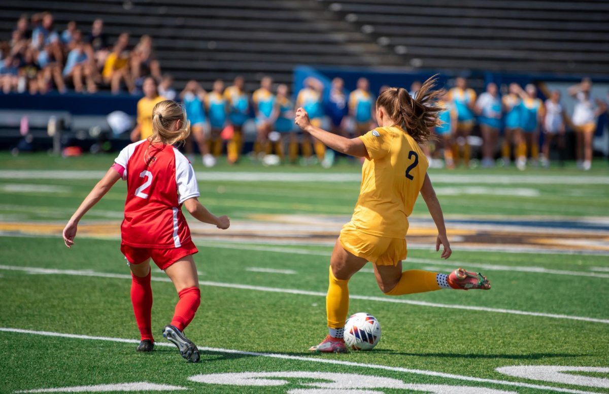 Samantha Miller, Kent State sophomore and midfielder, kicks the ball away from Jordyn Jeffers, Ball State graduate student and defender, Sept. 22, 2024. 