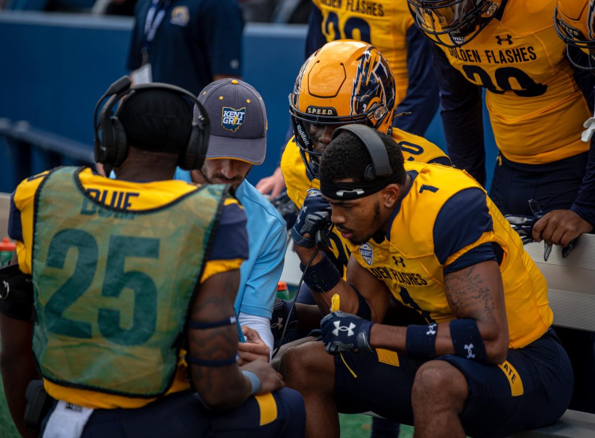 The Kent State Football team talk on the sideline as they prepare to head out onto the field during the first quarter against St. Francis, Sept. 7, 2024.