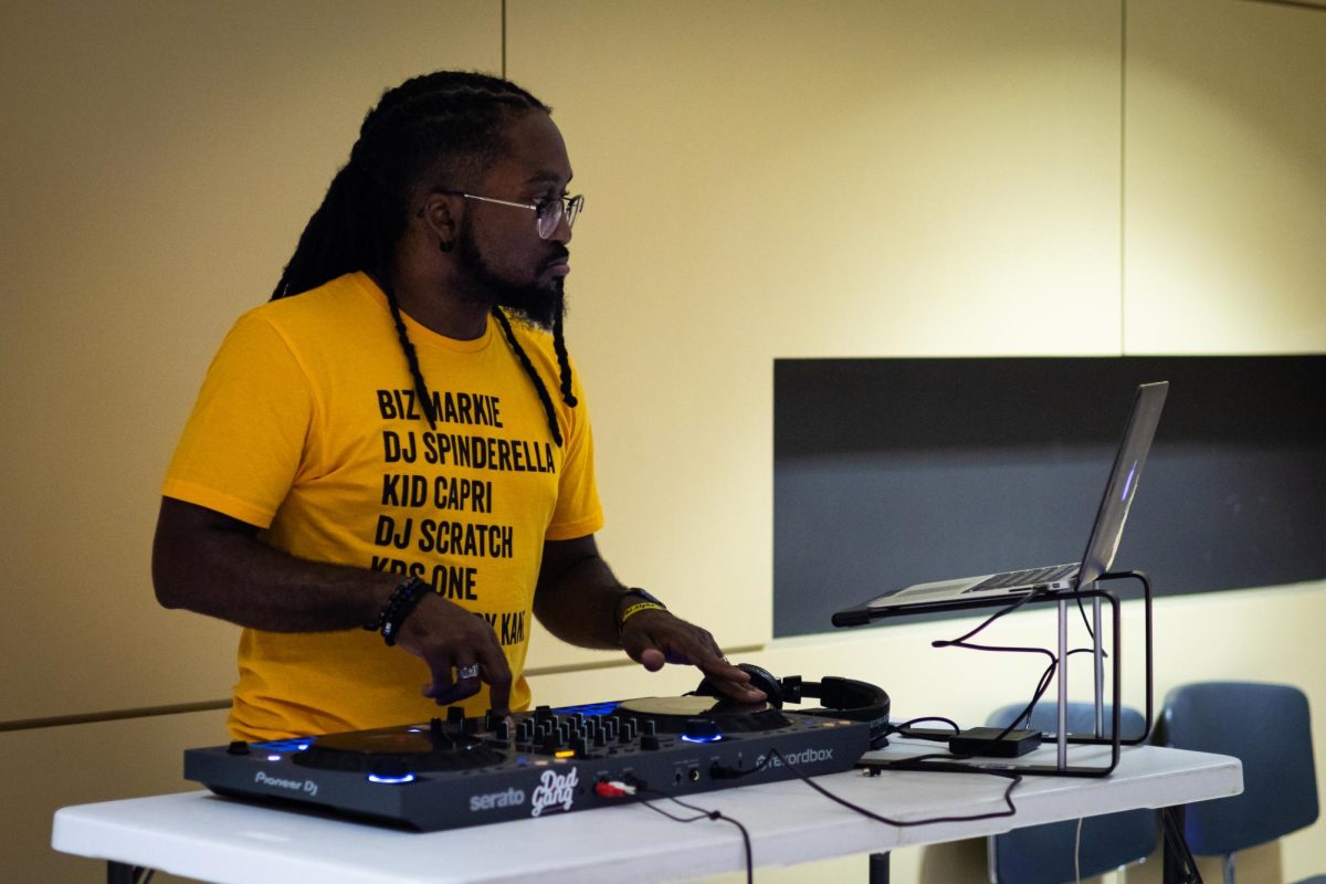 Kennedy Blaq, KSU Alum and current DJ, singer, and music teacher, DJs at the Black Alumni Chapter Homecoming Marketplace and Dance on Sept. 27, 2024.