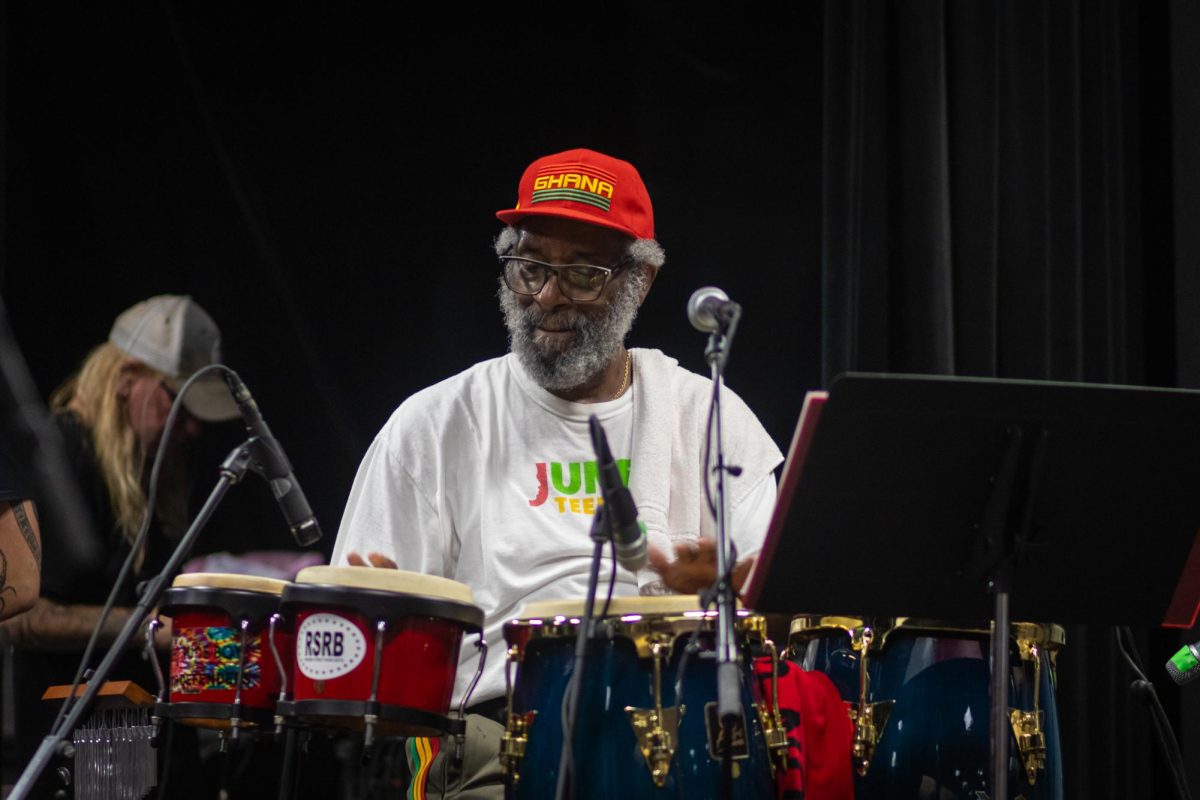 Mwatabu S. Okantah, Kent State professor and department chair, warms up before performing as a part of the band, Vince Robinson and the Jazz Poets, at the Black Alumni Chapter Homecoming Marketplace and Dance on Sept. 27, 2024.