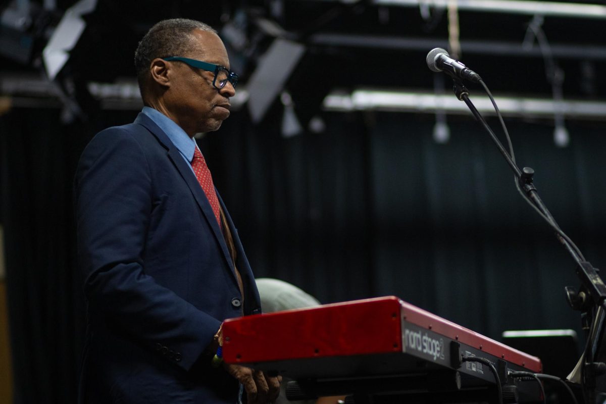 Vince Robinson, lead of Vince Robinson and the Jazz Poets and alum of Kent State's telecommunications program, is warming up on the keyboard to perform at the Black Alumni Chapter Homecoming Marketplace and Dance on Sept 27, 2024.