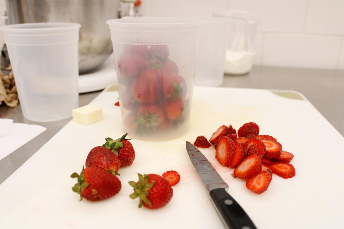 Strawberries cut up by Juinior, Tiffany Lai for her recipe, strawberry crumble muffins, during a culinary class in the DI Hub on September 13,2024.  