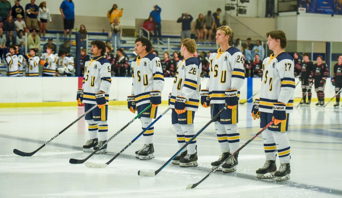 From the left to right, Kent State Ice Hockey Team's starting line up Adrian Sanchez, Reese Mills, Max Mudge, Brian Odstrchel, and Kyle Holmes, line up on the ice for the playing of the National Anthem before their game against Northern Illinois, Sept. 14th, 2024.