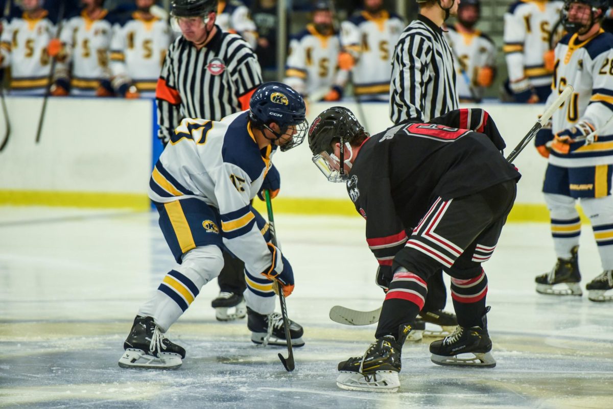 Kent State Freshman and Forward Reese Millls prepares to face-off against Northern Illinois Freshman and Forward Jeff Shirkey for possession of the puck in the third period, Sept. 13th, 2024.