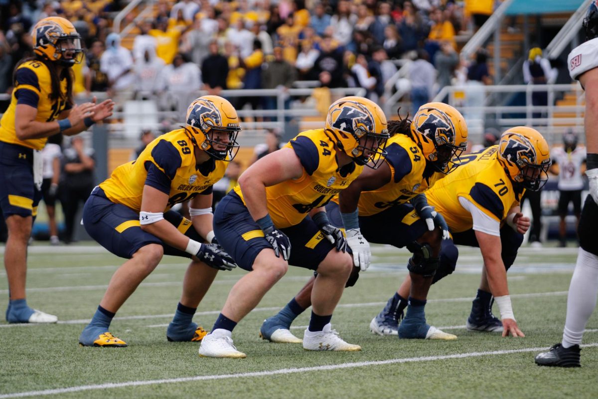 Kent State offensive linemen line up on the line during their home opener against Saint Francis University on September 7, 2024.