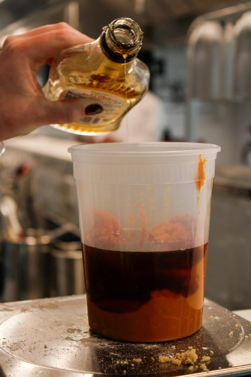 Senior, Sammy Wise pours maple syrup during a culinary class in the DI Hub on September 13, 2024. 