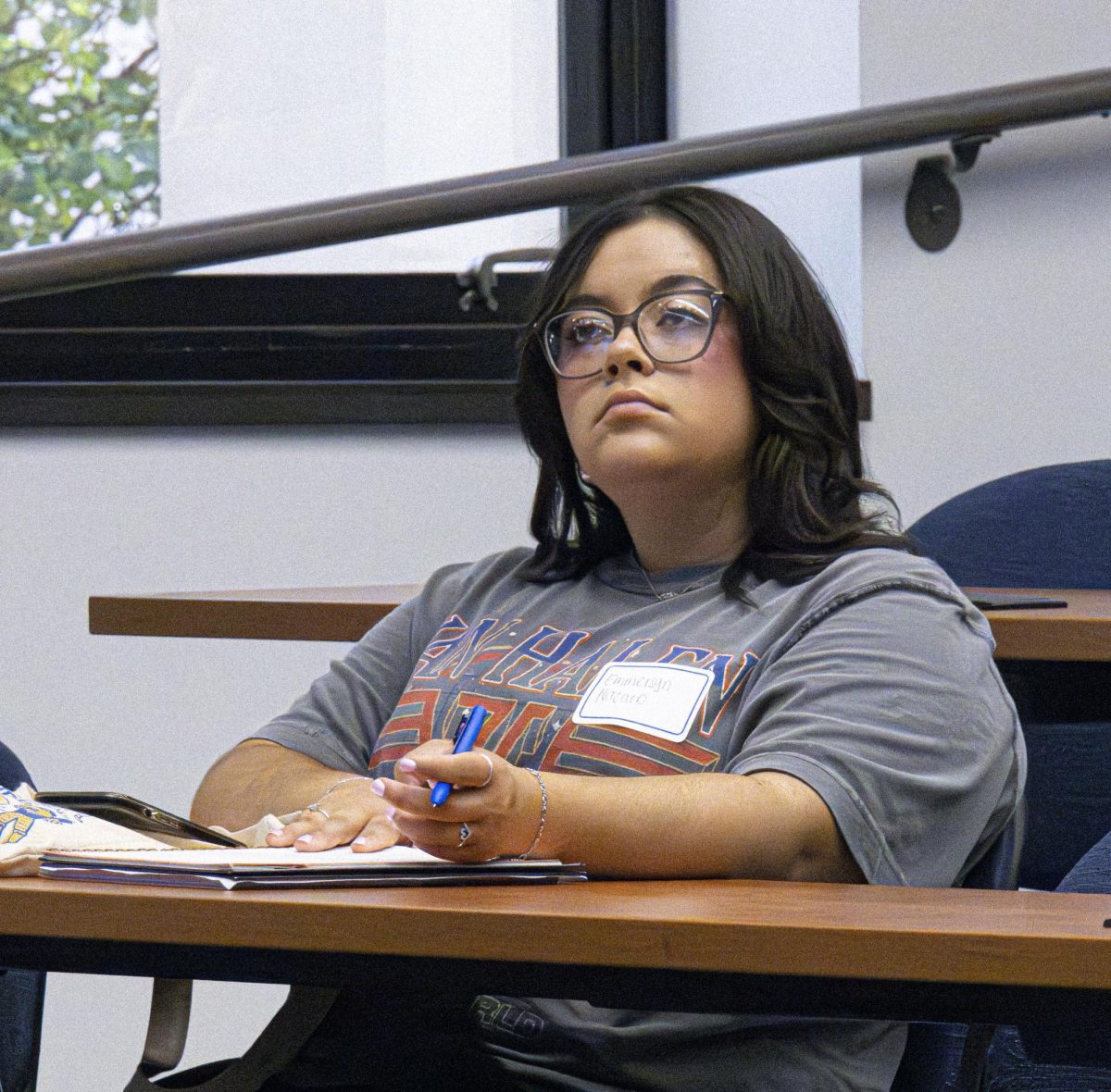 Fashion merchandising junior Emmersyn Nazario takes notes while listening to the panelists at the PRSSA Kent and Kent AAF Icons and Influencers event, Sept. 18, 2024.