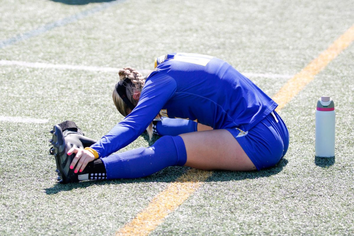 Kent senior goal-keeper Heidi Marshall warms up for the match against Ball State University on Sept. 22, 2024.