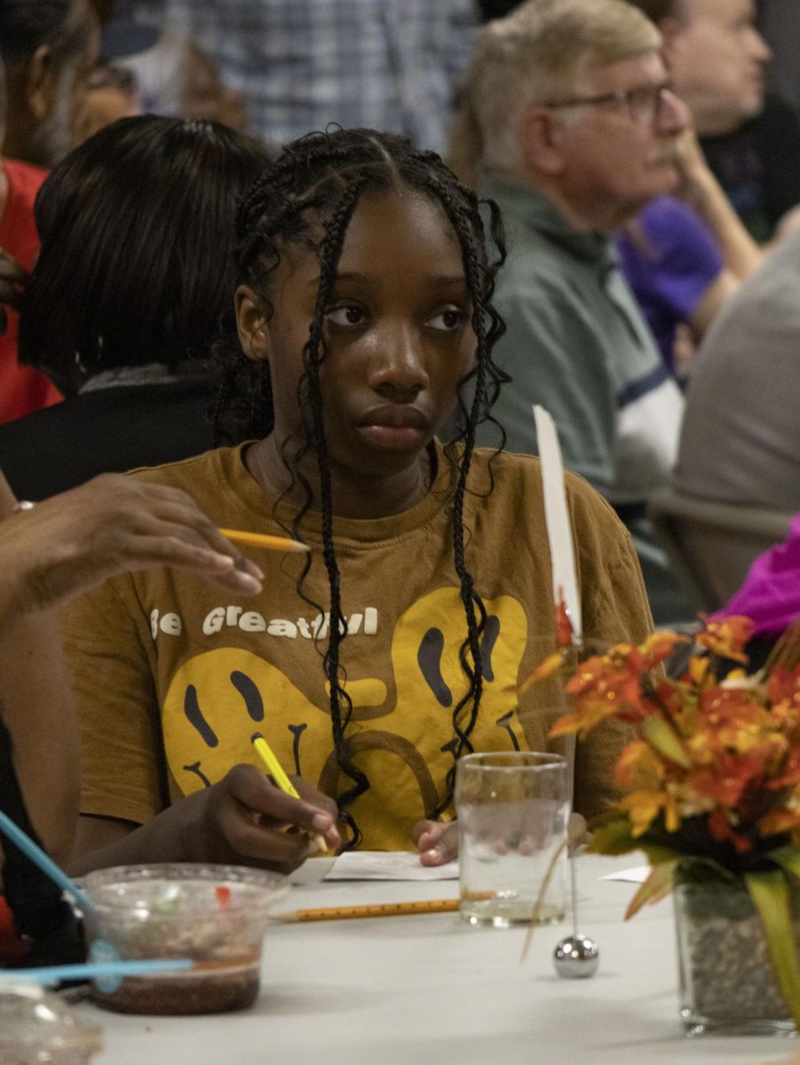 A citizen of Portage County records notes on her table’s concerns at the NAACP emergency meeting, Sept. 19, 2024.