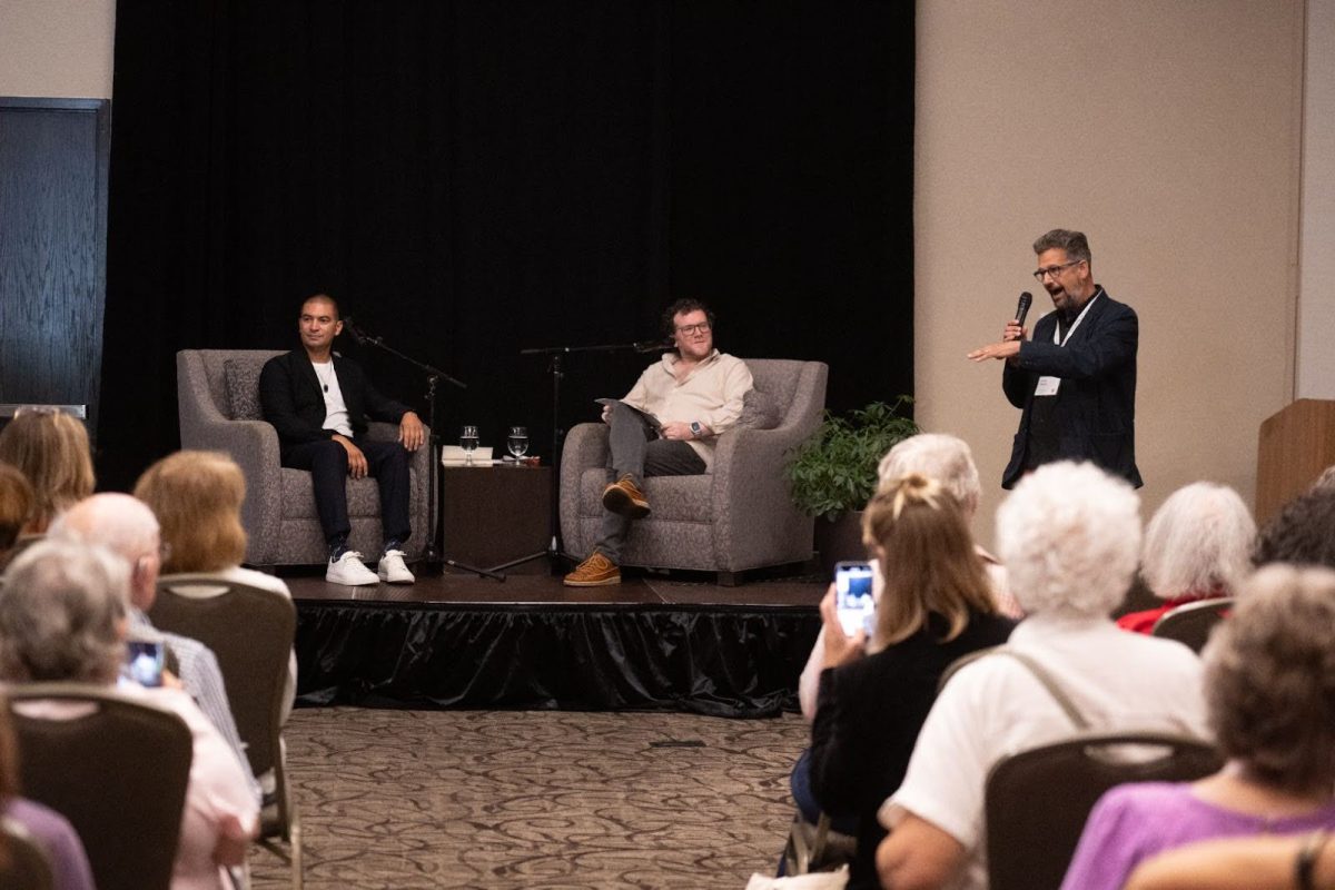 Guests speak at the opening of Wick Poetry Center's 40th anniversary celebration Sept. 19, 2024.