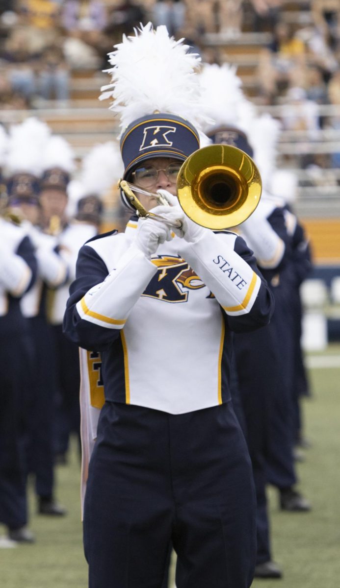 A member of the Marching Golden Flashes Homecoming football game against Eastern Michigan, Sept. 28, 2024.