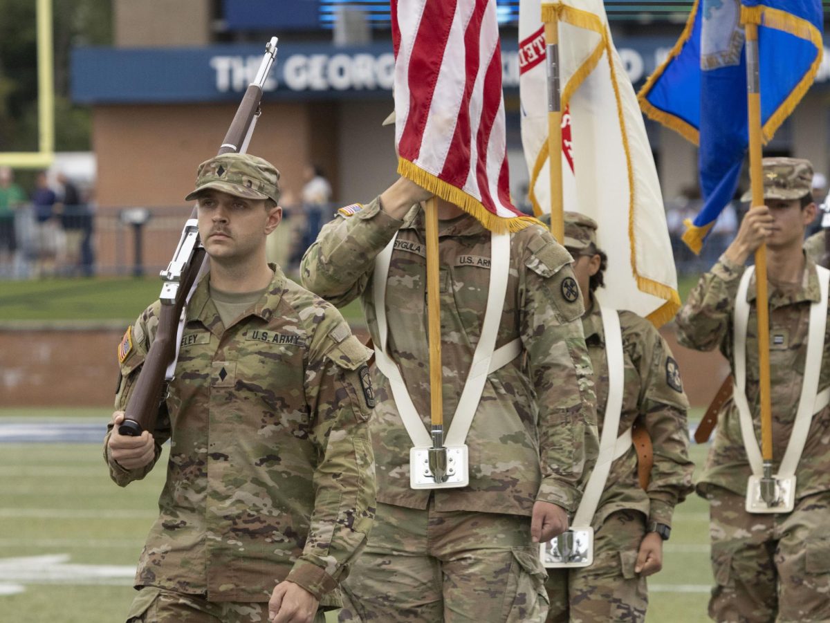 Members of the Kent State ROTC participate in the changing of the colors at the Homecoming football game against Eastern Michigan, Sept. 28, 2024.