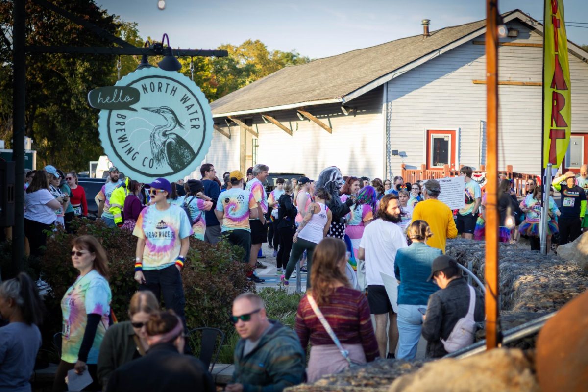 Drag race participants gather by North Water Brewing Co. right before the start of the Drag Race 5k on Oct. 11, 2024.