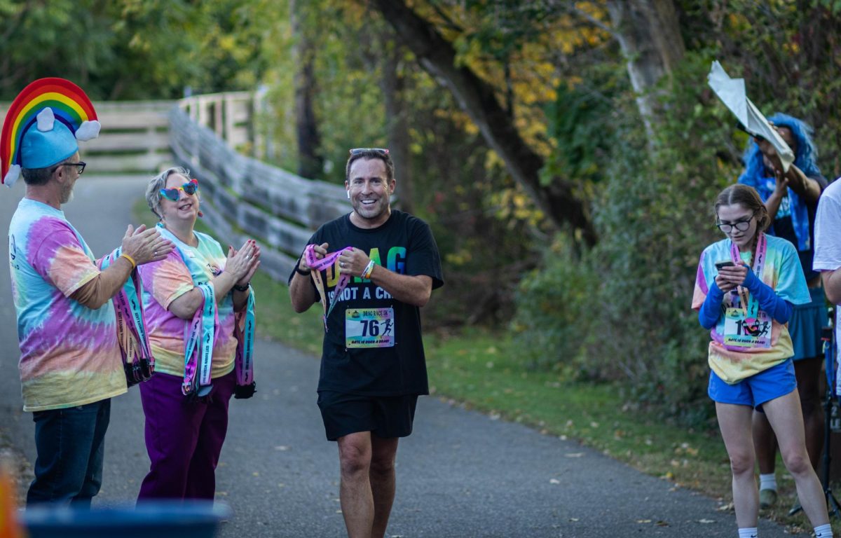 A drag race attendee receives a medal after the Drag Race 5k on Oct. 11, 2024. 