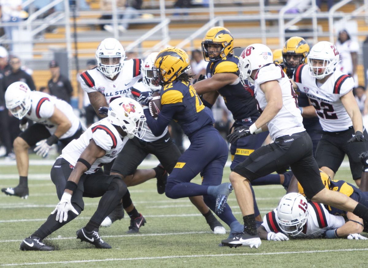 Freshman wide receiver Chrishon McCray (2) tries to avoid getting tackled by Ball State University players at the football game, Oct. 12, 2024.