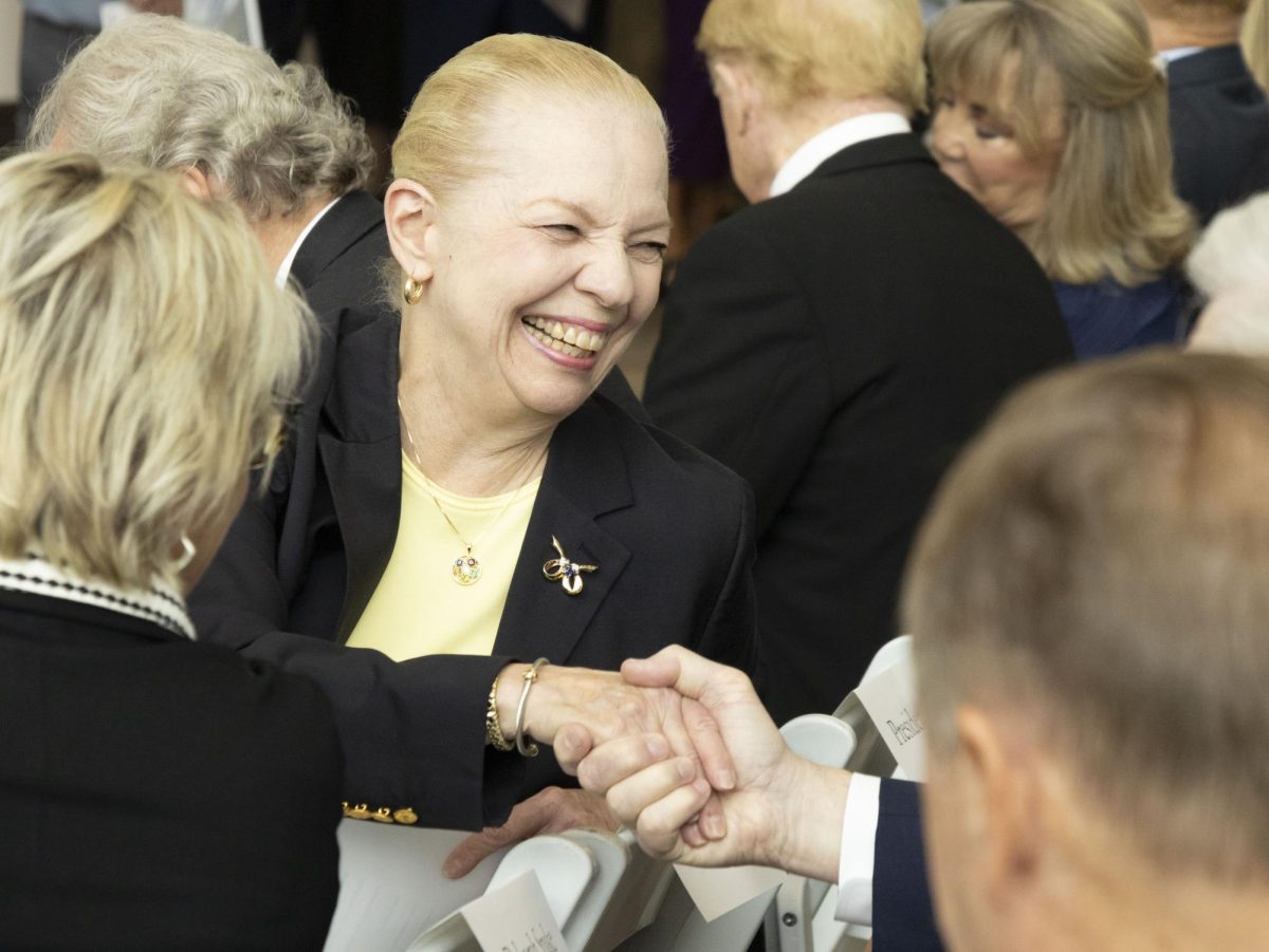 Kent State Board of Trustees member Ann Womer Benjamin greets another attendee of the Crawford Hall grand opening, Sept. 27, 2024.