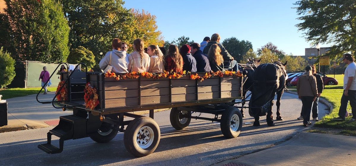 Students ride in a carriage at FAB's annual Fall Fest on Oct. 17 2024.