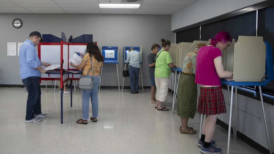 People arrive to cast their ballot during early voting in Minnesota on September 20, 2024