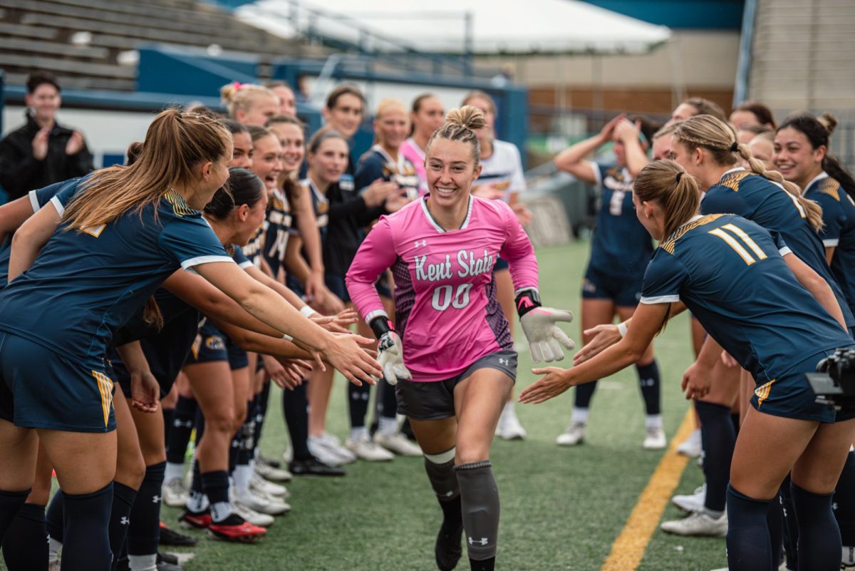 Heidi Marshall, Kent State senior goalkeeper, is cheered on by her team as they introduce the starting lineup before the start of the game against Bowling Green, Oct. 31, 2024.