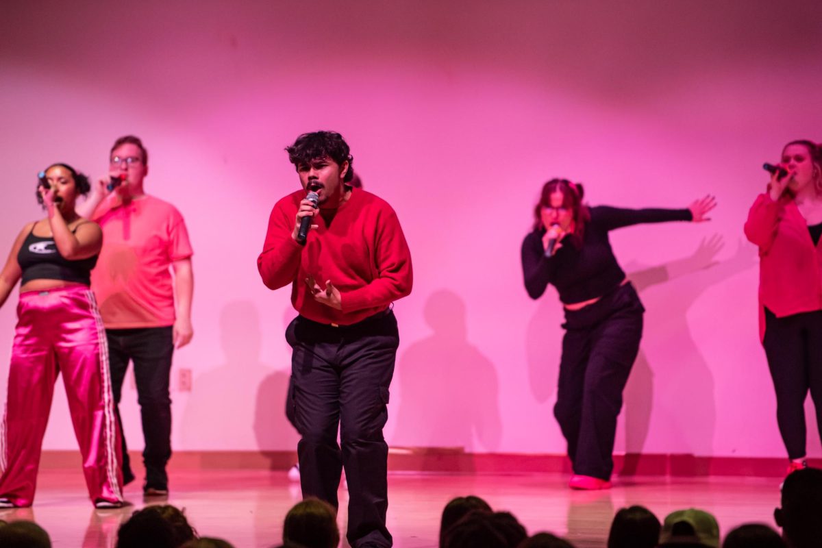 Vocal Intensity President Dylan Eshbaugh perfroms during the group's concert in the KIVA, Friday, Nov. 22, 2024.