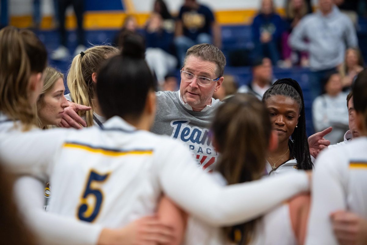 Head coach Todd Starkey speaks with the women's basketball team after their victory of Xavier, Friday, Nov. 23, 2024.